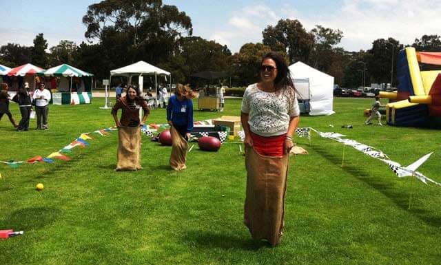 Outdoor potato sack race participants